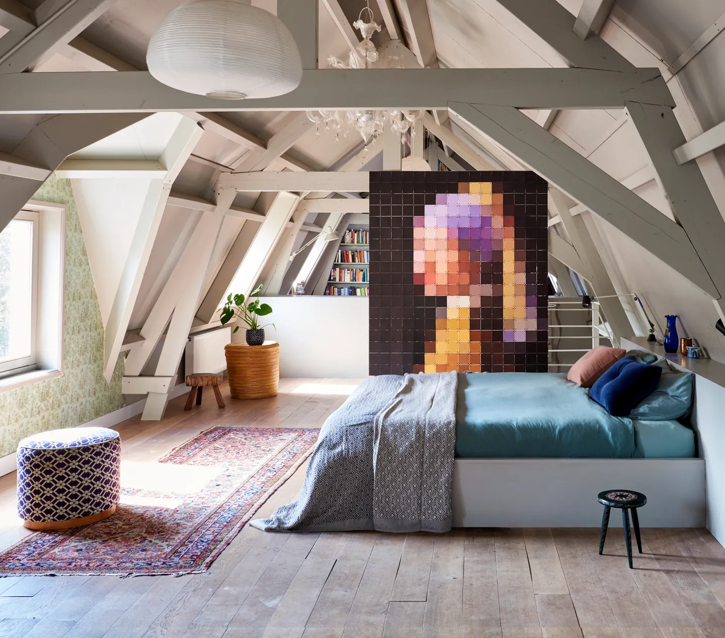 Pixel IXXI of Girl with a Pearl Earring as a room divider in an attic, between a bed and a desk