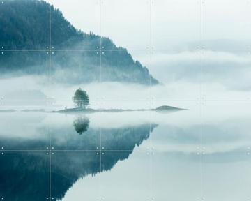 'Mirror Calm Lake With Lone Tree In Mist' by Claire Droppert