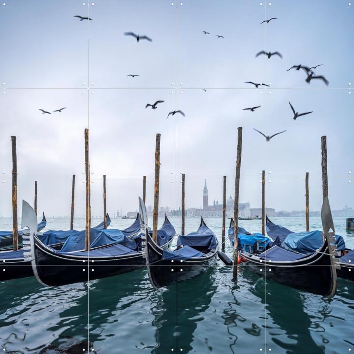 Gondolas at the pier with San Giorgio Maggiore island in the background, Venice, Italy