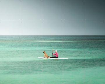 'Paddleboarder On Calm Tropical Waters' by Claire Droppert