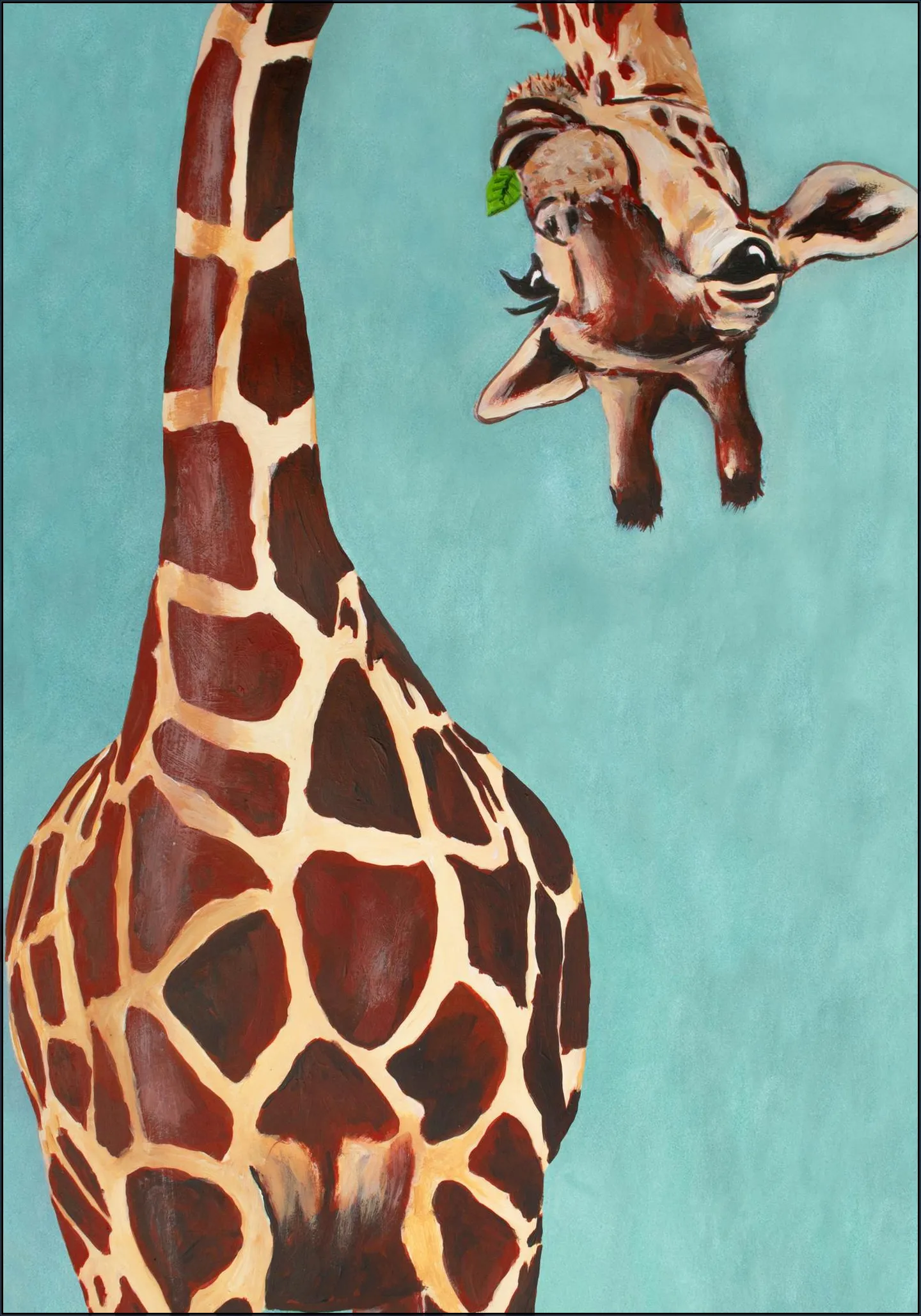 Giraffe with green leaf