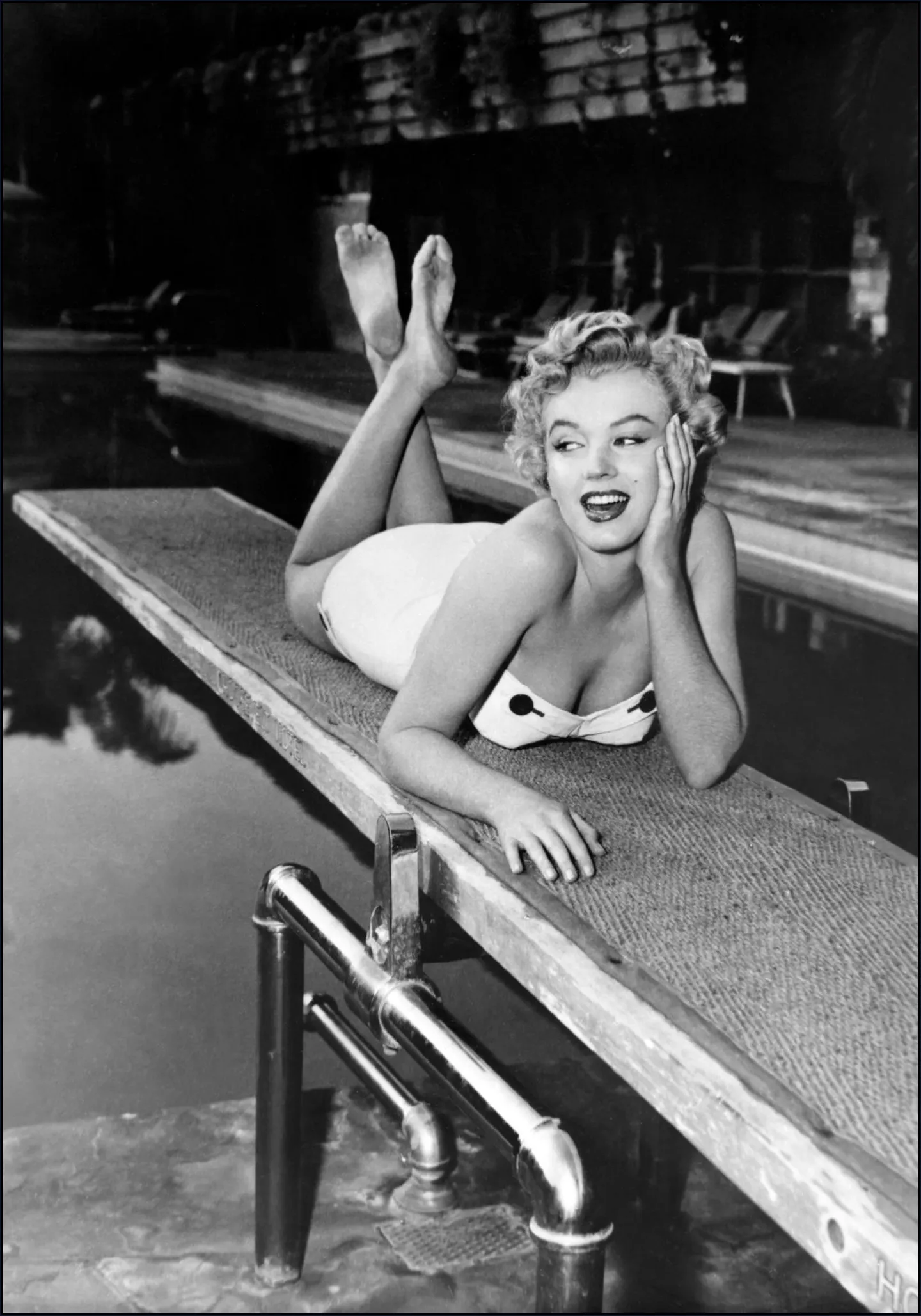 Marilyn Monroe lying on a springboard in California