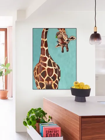 Giraffe with green leaf