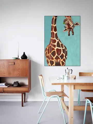 Giraffe with green leaf