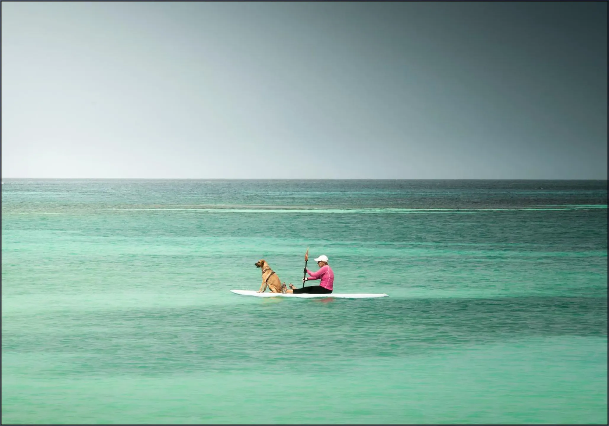 Paddleboarder On Calm Tropical Waters