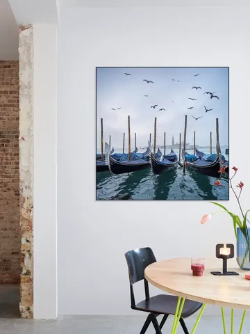 Gondolas at the pier with San Giorgio Maggiore island in the background, Venice, Italy