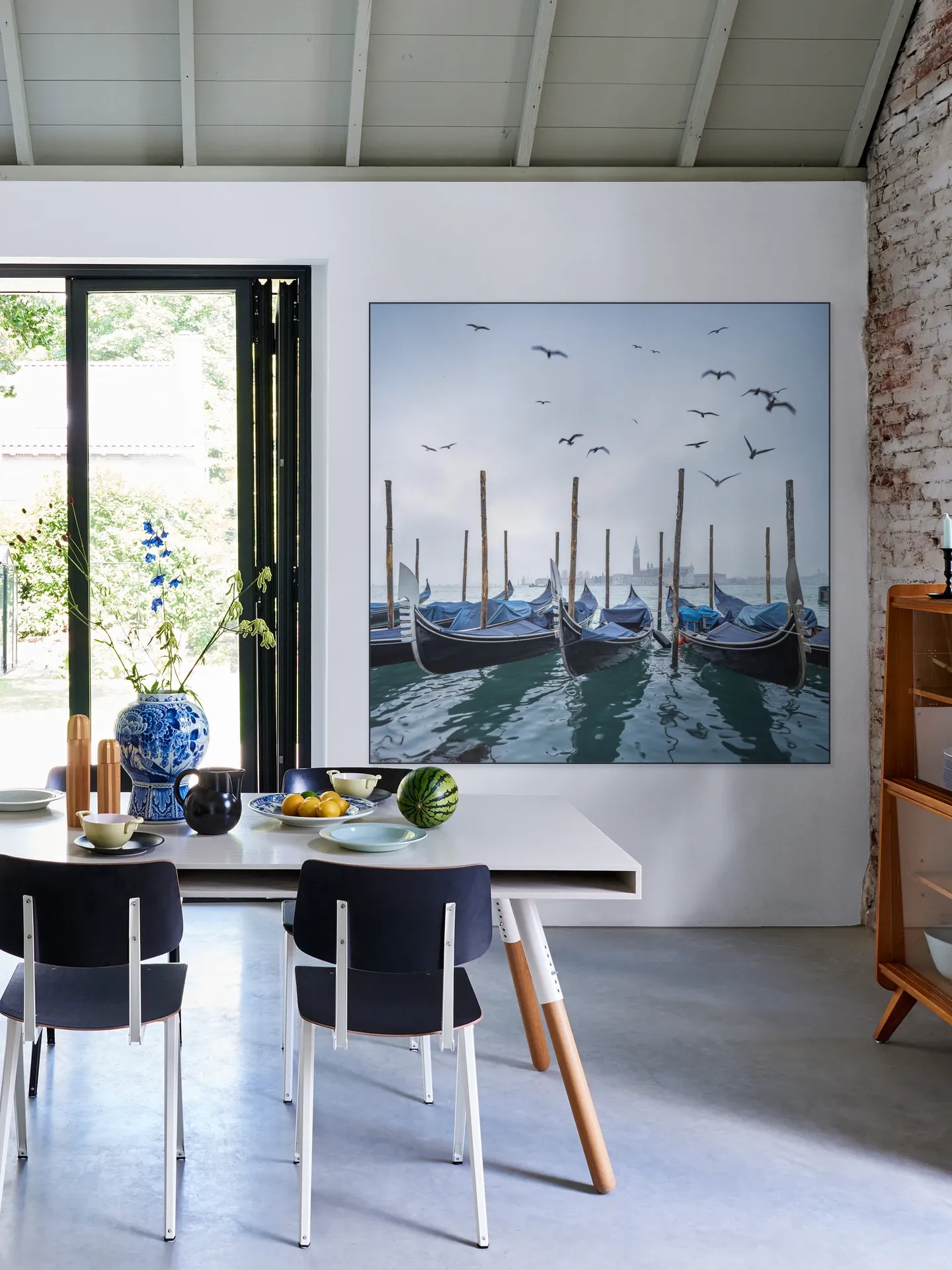 Gondolas at the pier with San Giorgio Maggiore island in the background, Venice, Italy