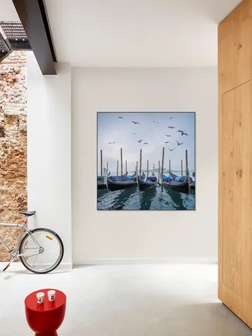 Gondolas at the pier with San Giorgio Maggiore island in the background, Venice, Italy