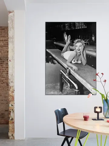 Marilyn Monroe lying on a springboard in California