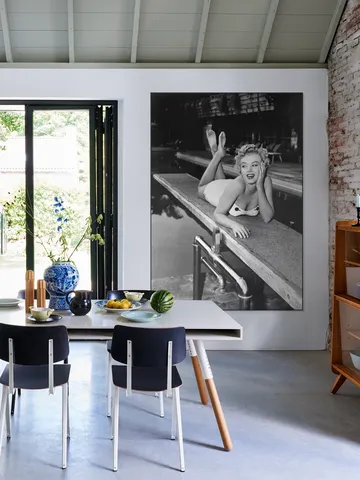 Marilyn Monroe lying on a springboard in California
