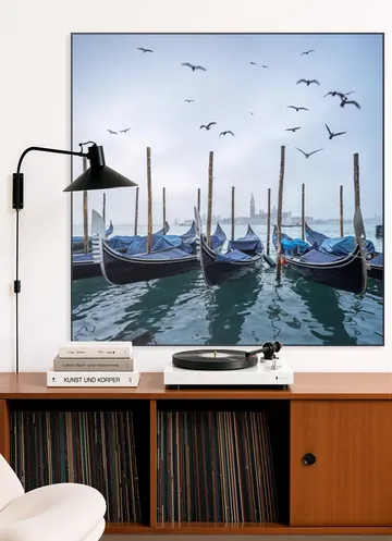 Gondolas at the pier with San Giorgio Maggiore island in the background, Venice, Italy