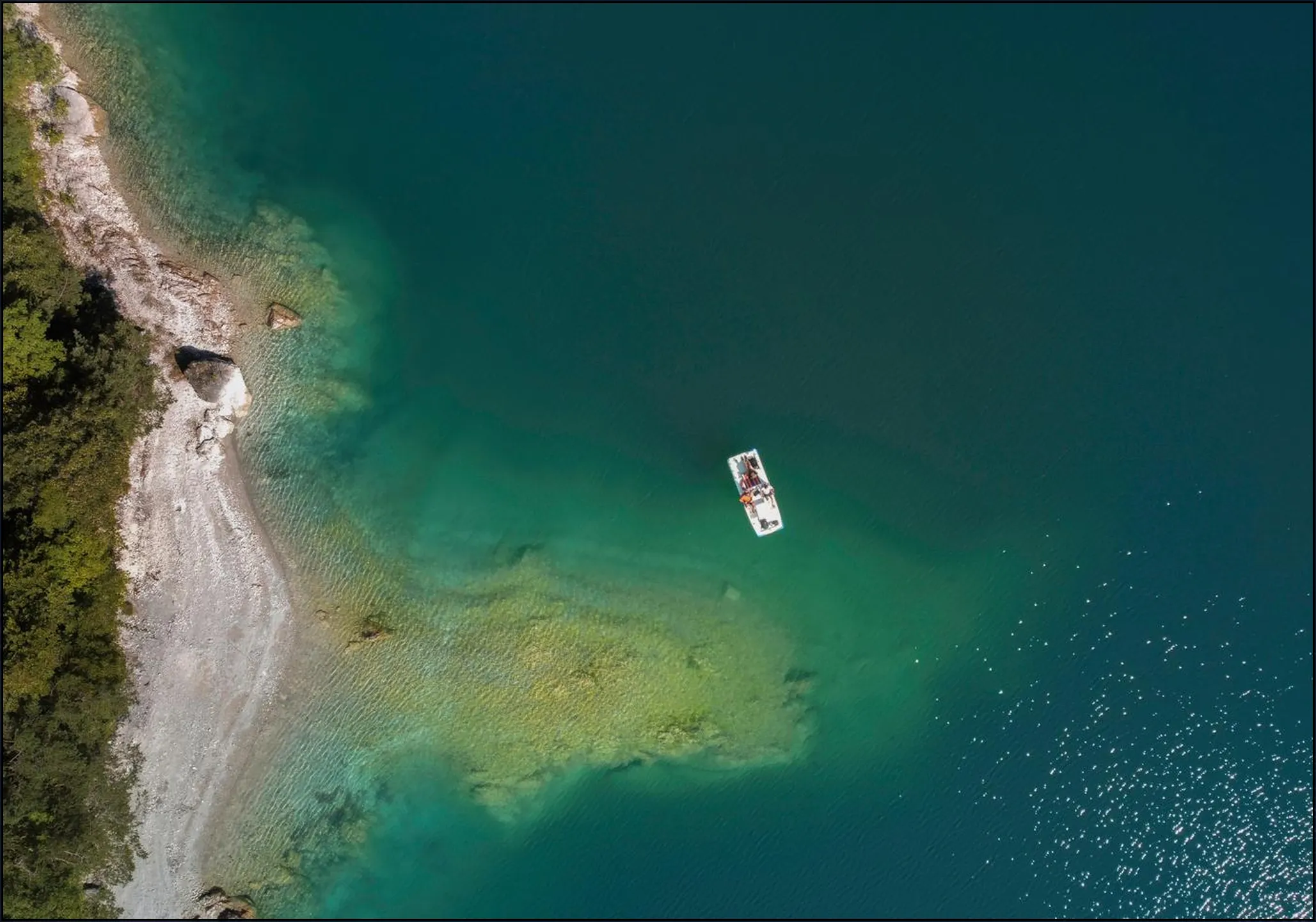 Aerial View Of Emerald Lake And Boat