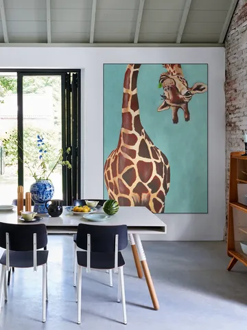 Giraffe with green leaf