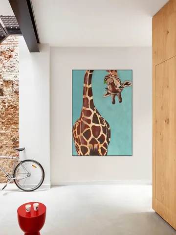 Giraffe with green leaf