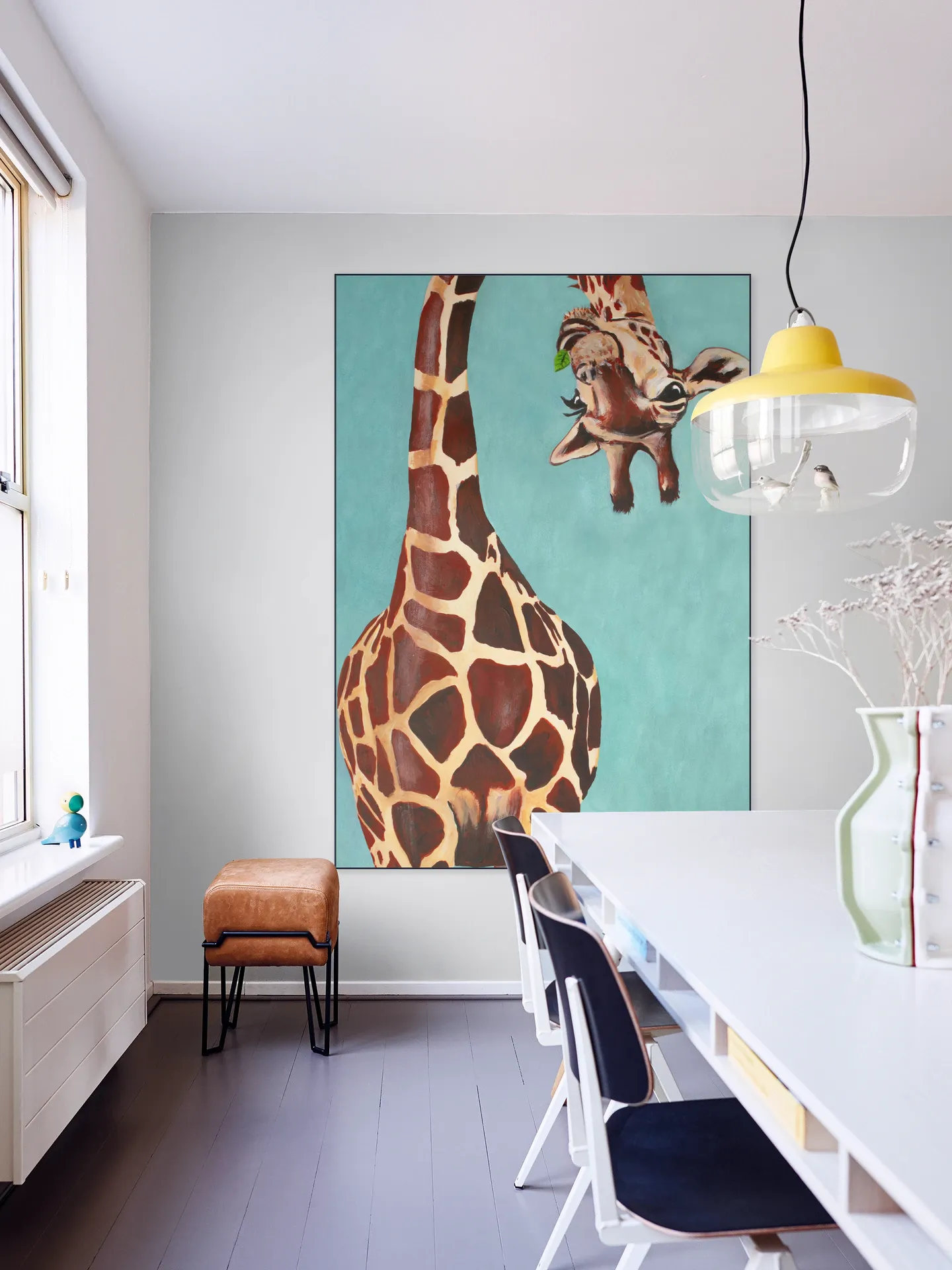 Giraffe with green leaf